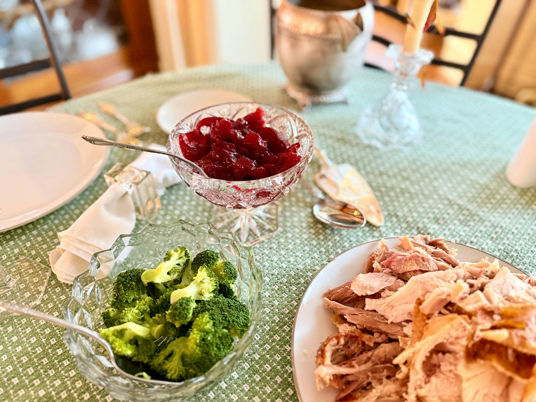 Thanksgiving dinner with turkey, cranberry sauce, and broccoli